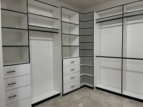 Custom built-in closet system with shelving and drawers