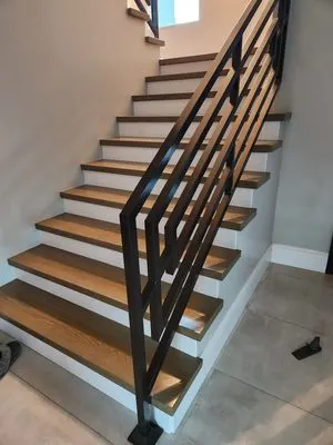 Dark wood treads staircase flooring installation by Rocca Tile in the Inland Empire