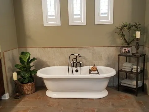Freestanding soaking tub in remodeled Chino bathroom