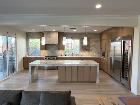 Open concept kitchen with white island and modern finishes