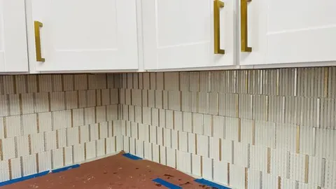 Vertical stacked stone-look tile wall installation
